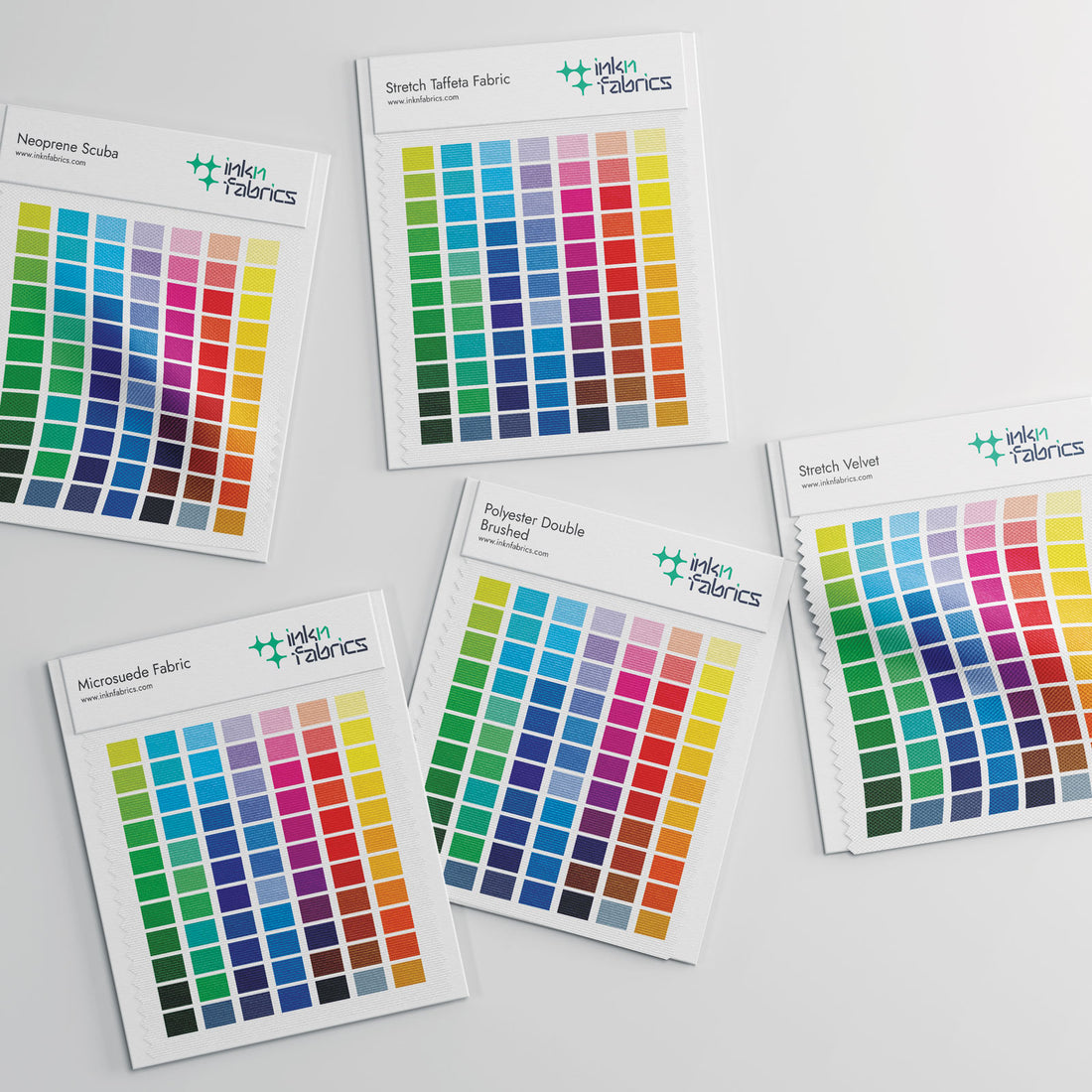 Professional fabric printing sample kit showing high-resolution textures.
